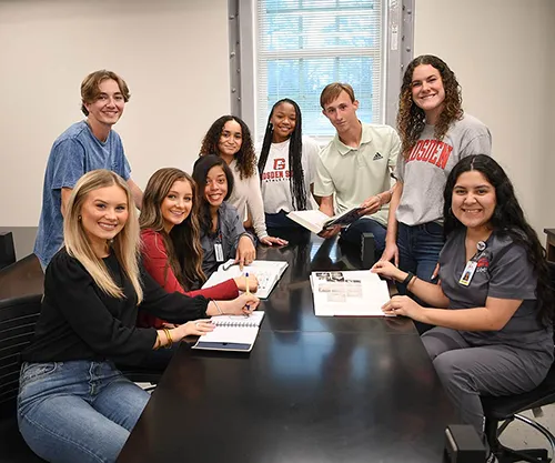 Group of students smiling for camera