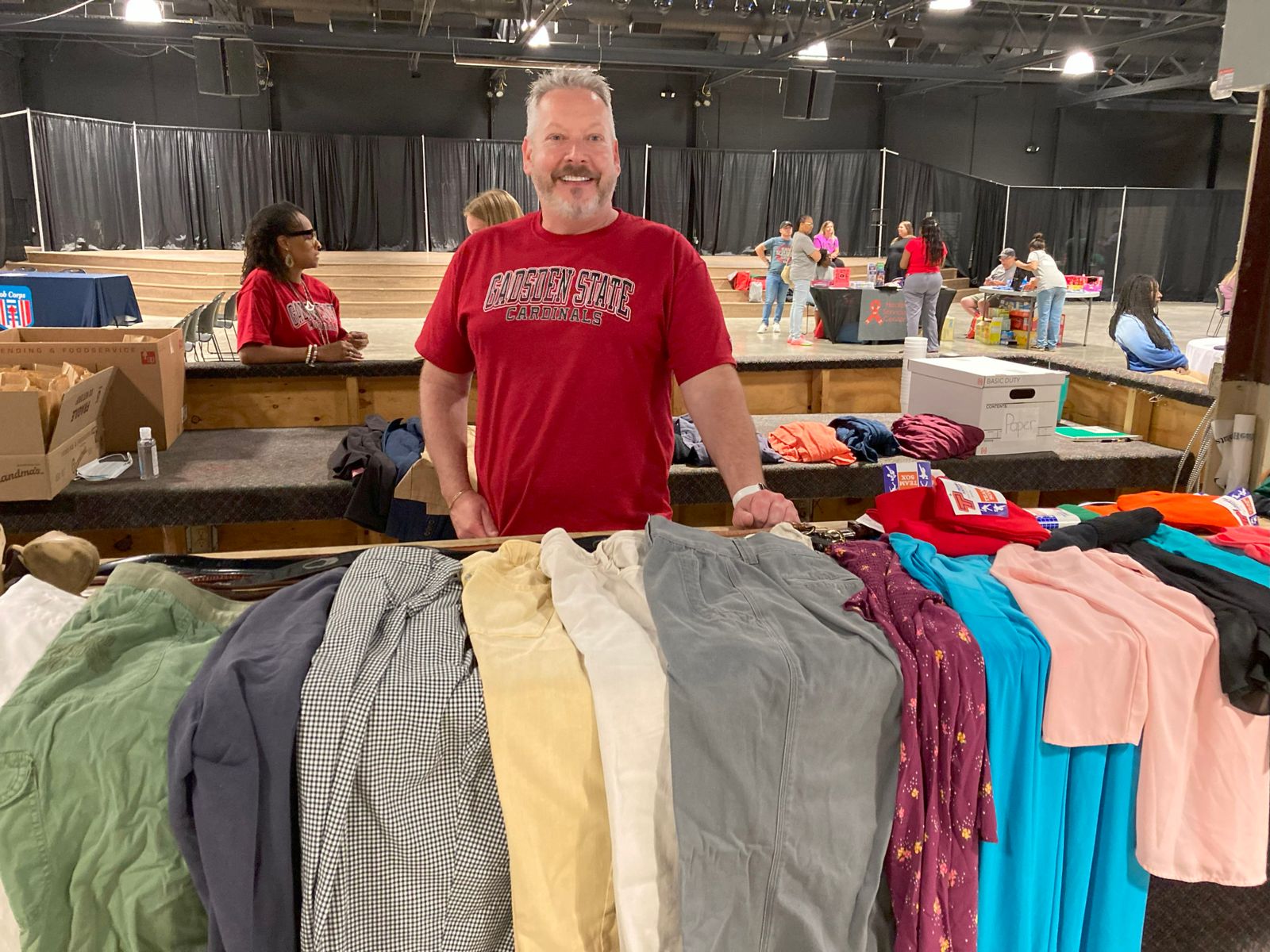 Dr. Joey Battles, dean of Health Sciences at Gadsden State, assisted Project Homeless Connect by distributing free clothes to homeless participants.