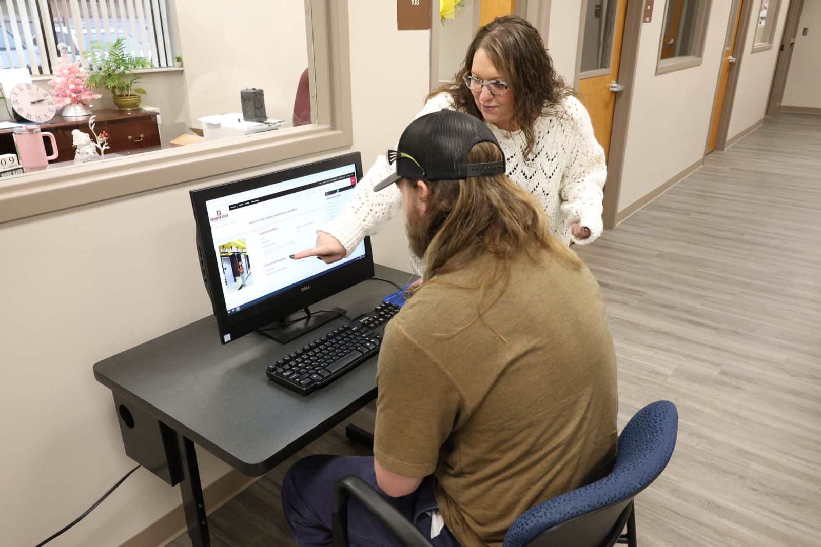 Tiffany Young, Gadsden State employee in the Financial Aid Office, assists a student at the One Stop Center on the Ayers campus.