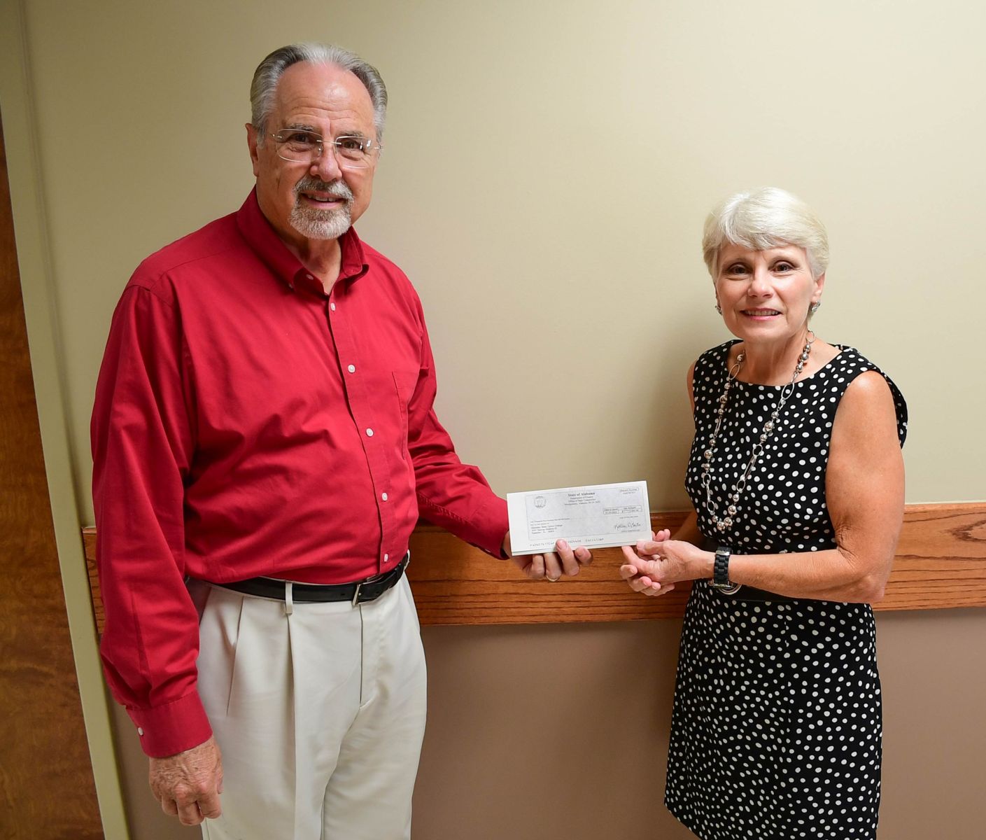 Rep. Mark Gidley presents donation check to President Kathy Murphy for Gadsden State scholarships.