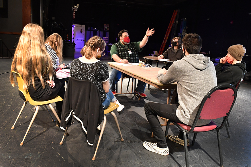 Matthew Huffman, middle, a theatre instructor at Gadsden State Community College, teachers a theatre class on the stage of Wallace Hall Fine Arts Center.