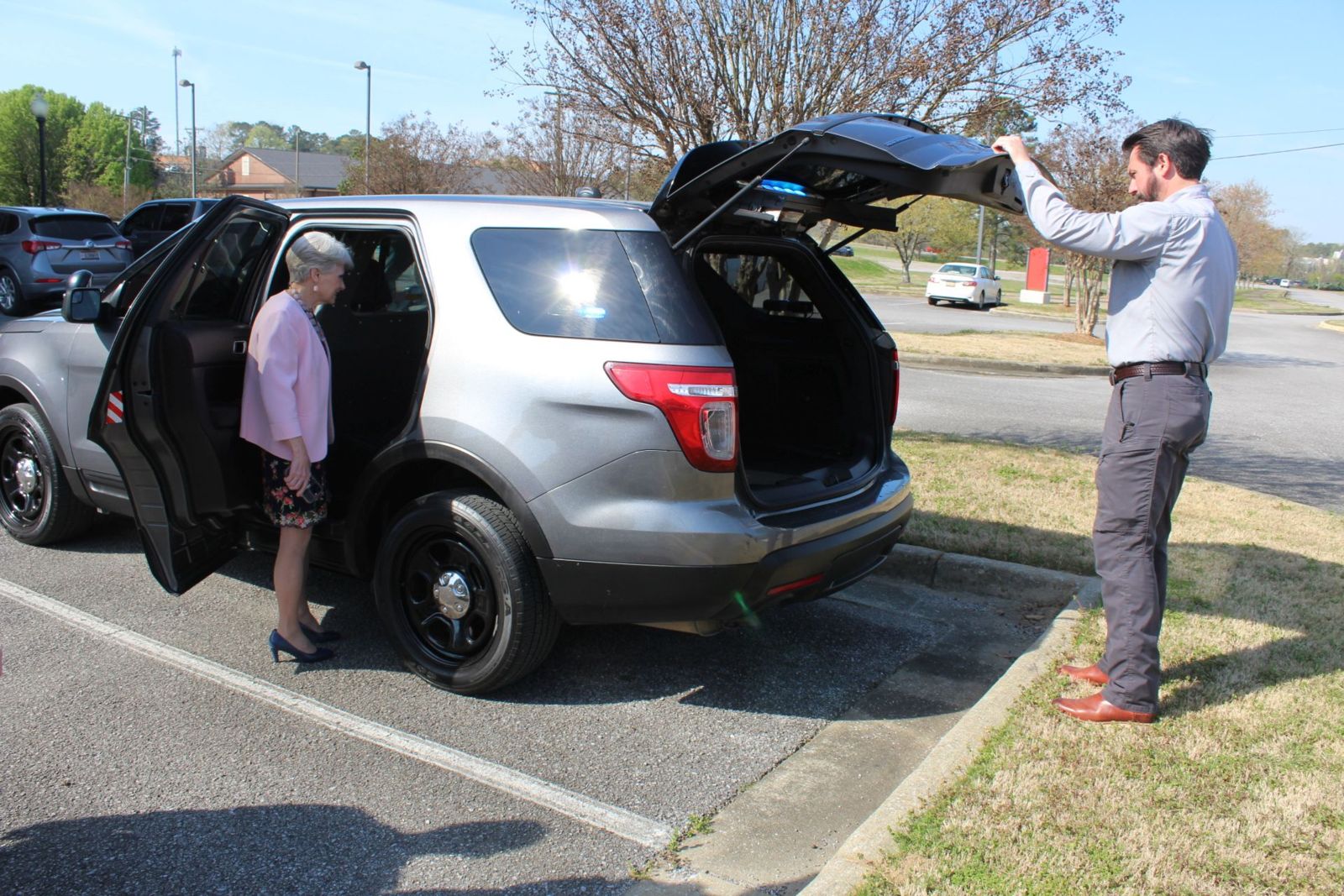 Dr. Kathy Murphy, president of Gadsden State, and Jay Freeman, chief of the Gadsden State Police and Public Safety Department, survey the fully-equipped patrol vehicle given to the College for one dollar from the City of Hokes Bluff.