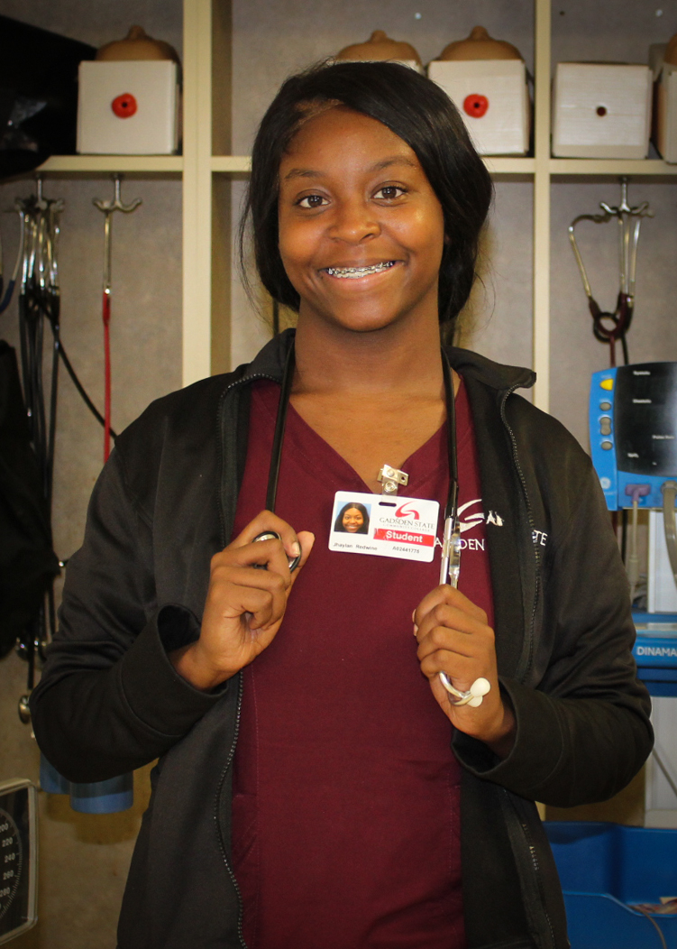 Photo of Jhaylan Redwine in her scrubs at Gadsden State Cherokee