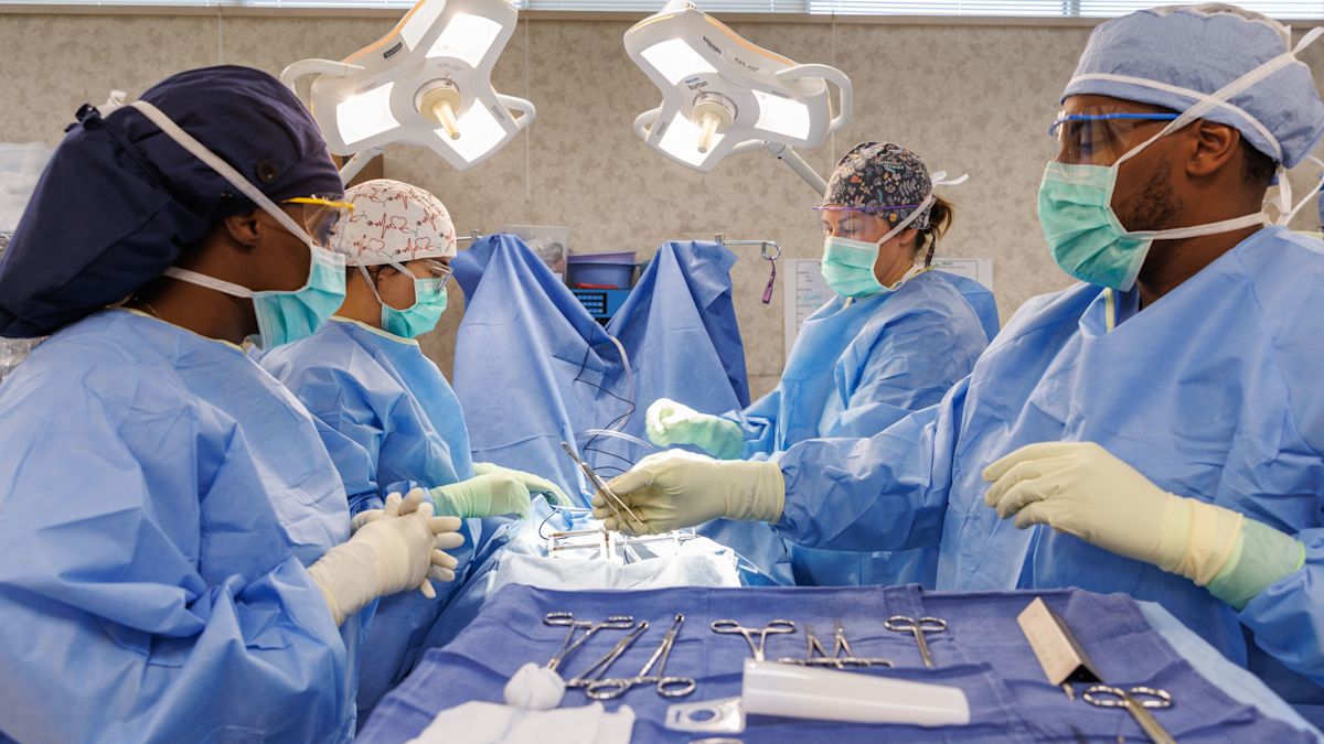 Medical professionals around the operating table