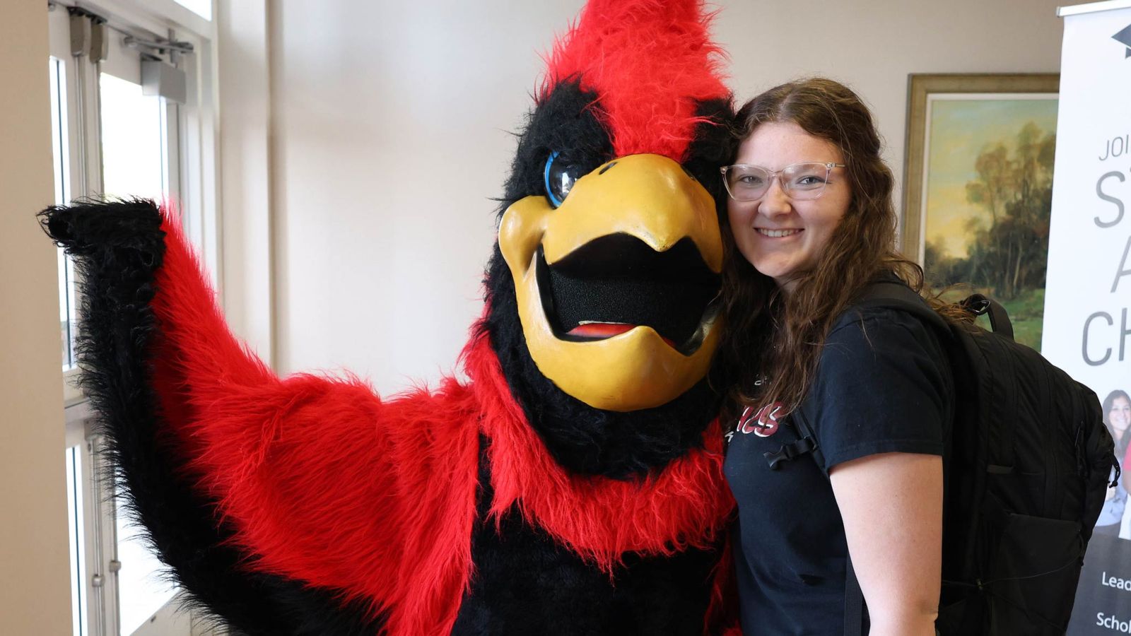 Swoop and a student at Gadsden State Cherokee